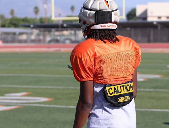 The caution decal on the back of his jersey warns all 11 defenders that something special is on the field. Photo: John Murphy